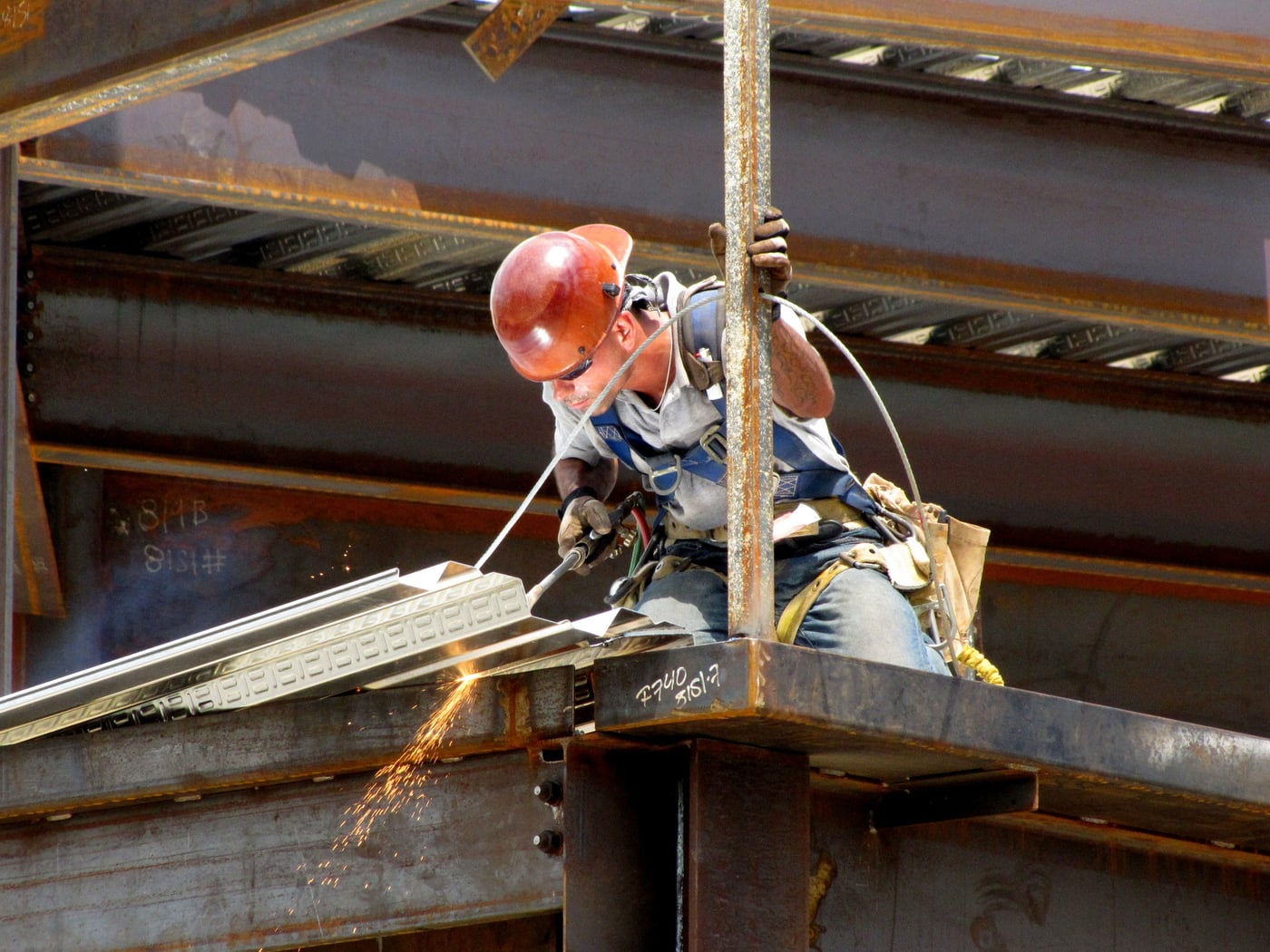 Construction worker welding steel