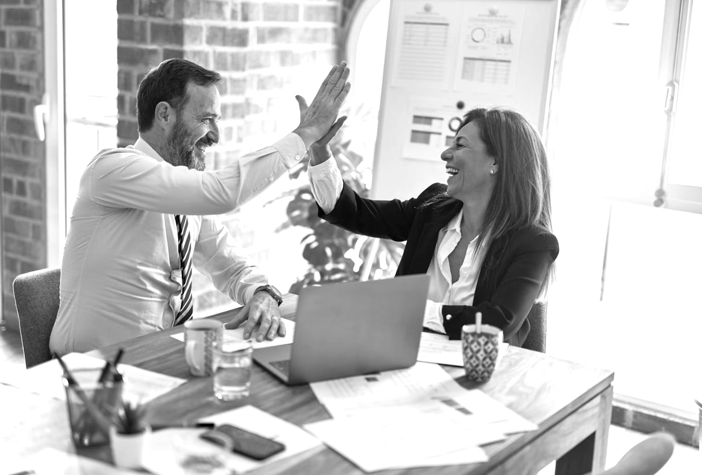 Colleagues celebrating with a high five